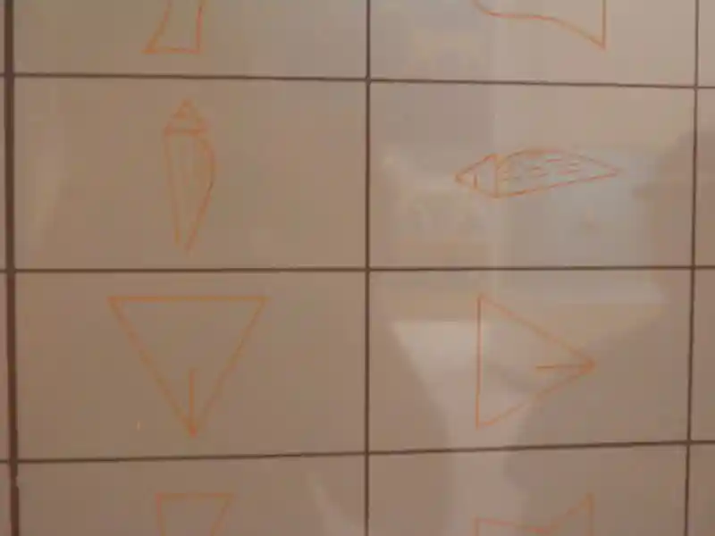 Long half circle with triangle and pubic triangles representing man and woman